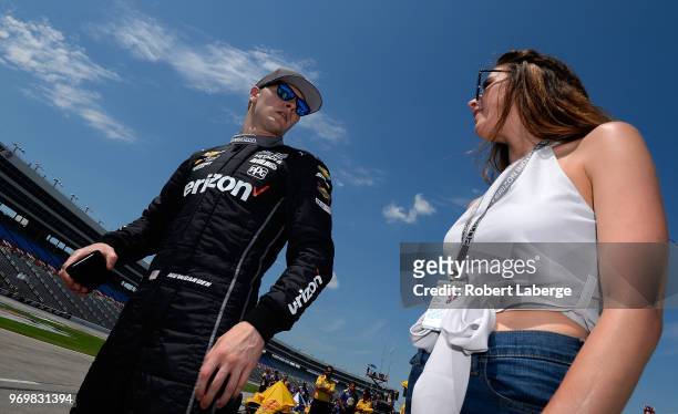 Josef Newgarden, driver of the Verizon Team Penske Chevrolet, stands on the grid during the US Concrete Qualifying Day for the Verizon IndyCar Series...