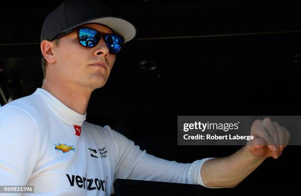 Josef Newgarden, driver of the Verizon Team Penske Chevrolet, stands on the grid during the US Concrete Qualifying Day for the Verizon IndyCar Series...