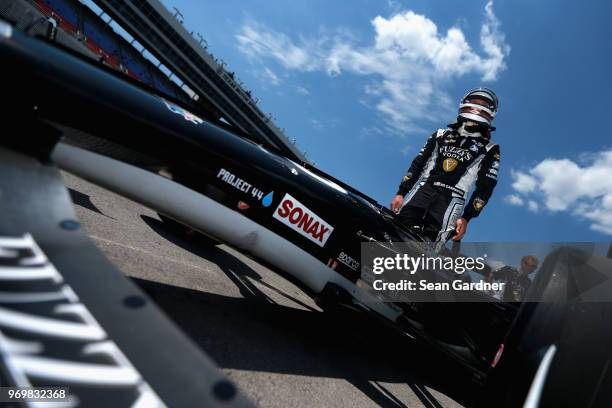 Ed Carpenter, driver of the Ed Carpenter Racing Fuzzy's Vodka Chevrolet, stands on the grid during the US Concrete Qualifying Day for the Verizon...