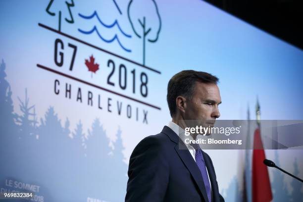 Bill Morneau, Canada's minister of finance, listens at a press conference during the Group of Seven Leaders Summit in La Malbaie, Quebec, Canada, on...