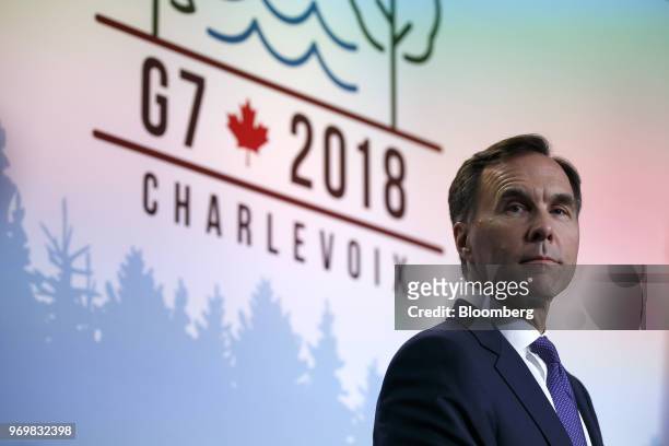 Bill Morneau, Canada's minister of finance, listens at a press conference during the Group of Seven Leaders Summit in La Malbaie, Quebec, Canada, on...