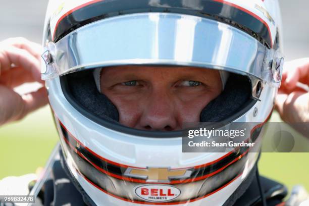 Ed Carpenter, driver of the Ed Carpenter Racing Fuzzy's Vodka Chevrolet, stands on the grid during the US Concrete Qualifying Day for the Verizon...