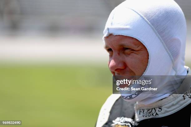 Ed Carpenter, driver of the Ed Carpenter Racing Fuzzy's Vodka Chevrolet, stands on the grid during the US Concrete Qualifying Day for the Verizon...