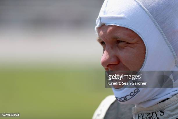 Ed Carpenter, driver of the Ed Carpenter Racing Fuzzy's Vodka Chevrolet, stands on the grid during the US Concrete Qualifying Day for the Verizon...