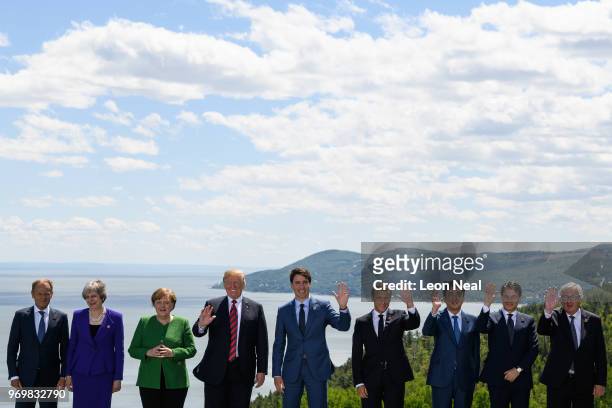 The nine leaders pose for the media during the Family photo on the first day of the G7 Summit, on 8 June, 2018 in La Malbaie, Canada. Canada will...