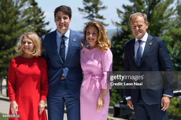 Canada's Prime Minister Justin Trudeau and President of the European Council Donald Tusk stand with their wives Malgorzata Tusk and Sophie Gregoire...