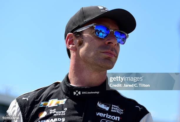 Simon Pagenaud, driver of the DXC Technology Team Penske Chevrolet, stands on the grid during the US Concrete Qualifying Day for the Verizon IndyCar...