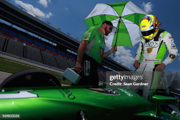 Spencer Pigot, driver of the Ed Carpenter Racing Fuzzy's Vodka Chevrolet, sits in his car during the US Concrete Qualifying Day for the Verizon...