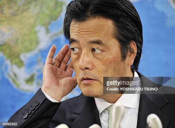 Japanese Foreign Minister Katsuya Okada listens to a question during a press conference at his office in Tokyo on February 16, 2010 where he said he...