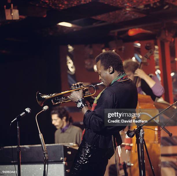 American trumpeter and composer Miles Davis performs on stage with pianist Chick Corea and bassist Dave Holland for the BBC 'Jazz Scene' television...