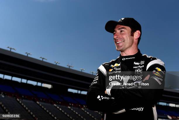 Simon Pagenaud, driver of the DXC Technology Team Penske Chevrolet, stands on the grid during the US Concrete Qualifying Day for the Verizon IndyCar...