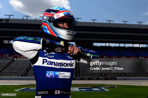 Takuma Sato, driver of the ABeam Consulting Honda, stands on the grid during the US Concrete Qualifying Day for the Verizon IndyCar Series DXC...