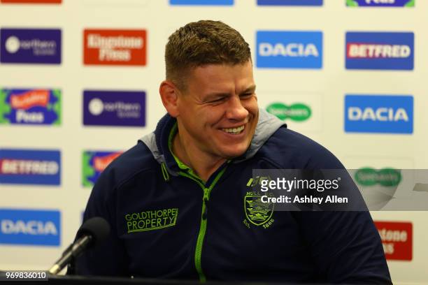 Lee Radford coach of Hull FC has a laugh during a press conference after the Betfred Super League match between Hull FC and Salford Red Devils at...