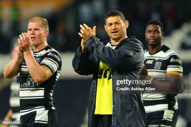 Mark Minichiello ,Danny Washbrook and Masi Matongo of Hull FC applaud the crowd during the Betfred Super League match between Hull FC and Salford Red...