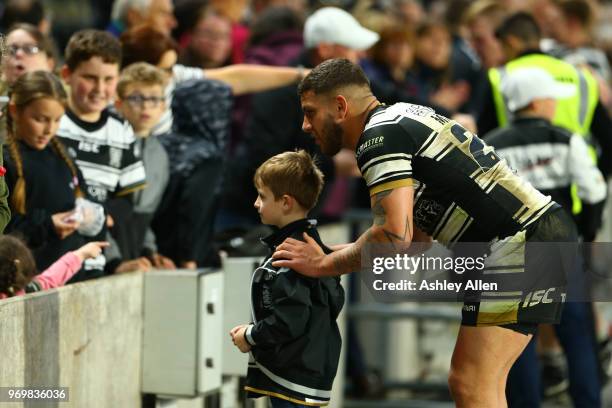 Hakim Miloudi of Hull FC poses for a photo with a fan during the Betfred Super League match between Hull FC and Salford Red Devils at KCOM Stadium on...