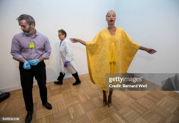 With the help of independent curator Matthew Bird and senior textile conservator Chris Paulocik , Canadian model Stacey McKenzie wears a cape made by...