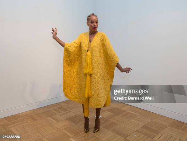 Canadian model Stacey McKenzie wears a cape, made by the silk of 1.2 million female Golden Orb Weaver spiders, inside the The Royal Ontario Museum,...