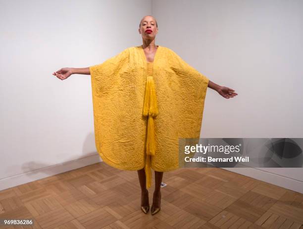 Canadian model Stacey McKenzie wears a cape, made by the silk of 1.2 million female Golden Orb Weaver spiders, inside the The Royal Ontario Museum,...