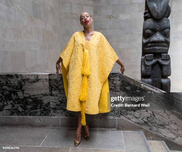 Canadian model Stacey McKenzie wears a cape, made by the silk of 1.2 million female Golden Orb Weaver spiders, inside the The Royal Ontario Museum,...