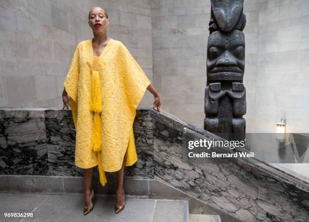 Canadian model Stacey McKenzie wears a cape, made by the silk of 1.2 million female Golden Orb Weaver spiders, inside the The Royal Ontario Museum,...