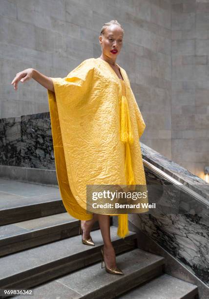 Canadian model Stacey McKenzie wears a cape, made by the silk of 1.2 million female Golden Orb Weaver spiders, inside the The Royal Ontario Museum,...