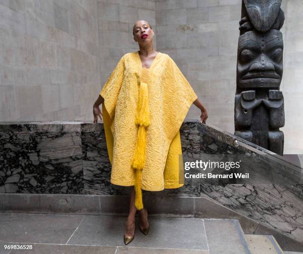 Canadian model Stacey McKenzie wears a cape, made by the silk of 1.2 million female Golden Orb Weaver spiders, inside the The Royal Ontario Museum,...