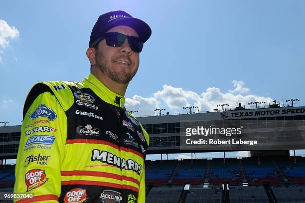 Matt Crafton, driver of the Matador/Menards Ford, stands on the grid during the US Concrete Qualifying Day for the NASCAR Camping World Truck Series...