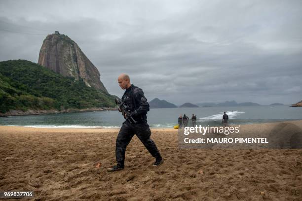 Member of the military police, patrols during a police operation in which they chased drug dealers escaping from Babilonia favela and staged a...