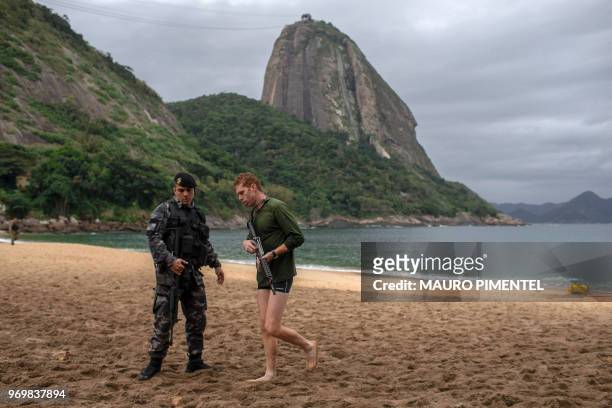 Members of the military police, patrol the area during a police operation in which they chased drug dealers escaping from Babilonia favela and staged...