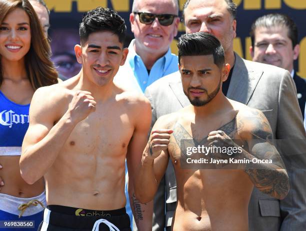 Leo Santa Cruz and Abner Mares pose at the weigh-in for their WBA Featherweight and WBC Diamond title fight against at Staples Center on June 8, 2018...