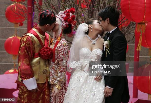 Zero Yau Man-hong and Rain Siu Wang-Shan wearing traditional Chinese costume and Gigi Hui Sin-Chi and Ken Cheng Chi-kin wearing Western style wedding...