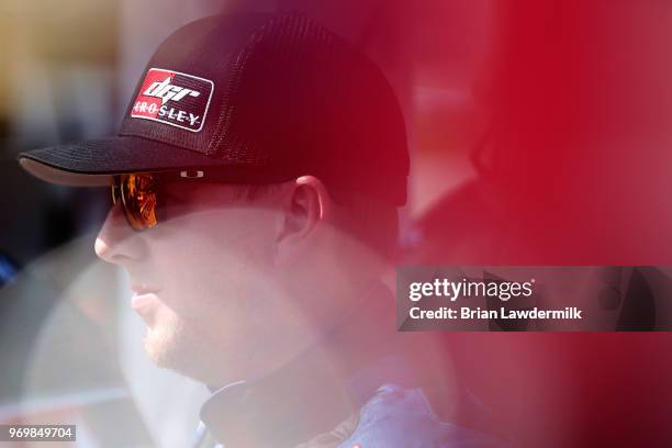 Chris Eggleston, driver of the GlobeSprinkler.com/H2O Fire Protection Inc., stands on the grid during the US Concrete Qualifying Day for the NASCAR...