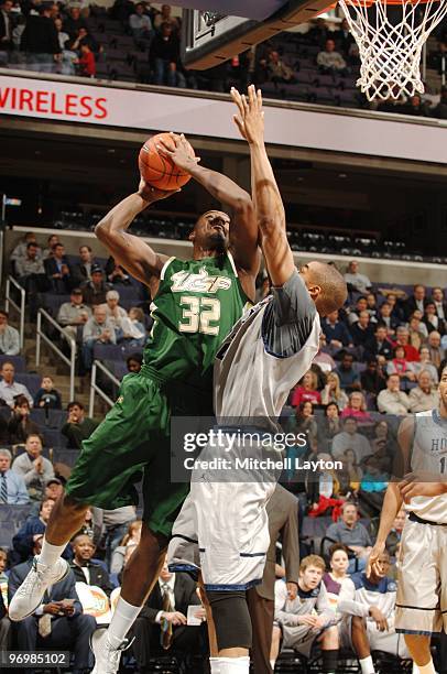 Toarlyn Fitzpatrick of the South Florida Bulls drives to the basket for a shot during a college basketball game against the Georgetown Hoyas on...