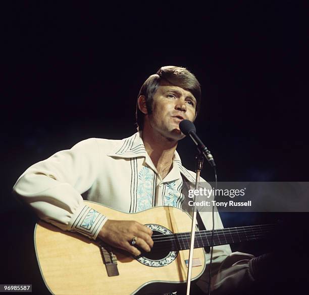 American singer Glen Campbell performs on a television show circa 1974.