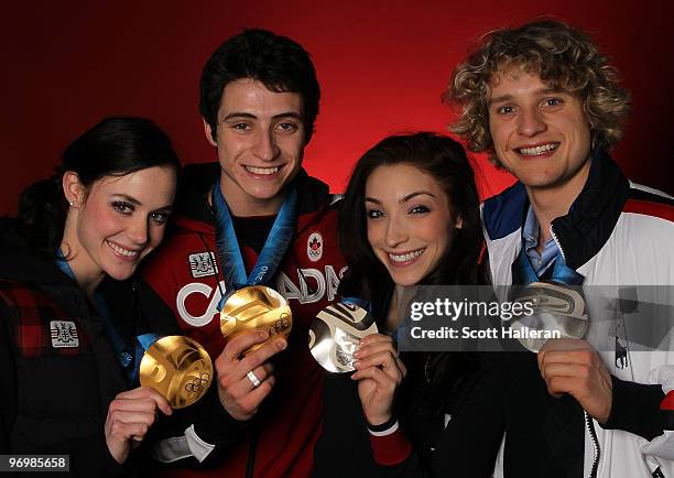 Ice dance figure skaters Tessa Virtue and Scott Moir of Canada, pose with their gold medals alongside silver medal winners Meryl Davis and Charlie...