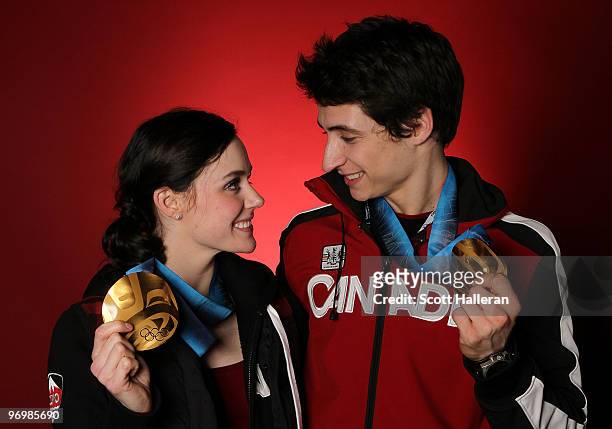 Figure skaters Tessa Virtue and Scott Moir of Canada pose with their ice dance gold medals in the NBC Today Show Studio at Grouse Mountain on...