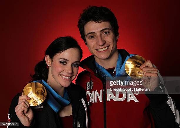 Figure skaters Tessa Virtue and Scott Moir of Canada pose with their ice dance gold medals in the NBC Today Show Studio at Grouse Mountain on...