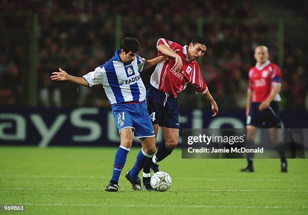 Abdelilah Fahmi of Lille and Juan Valeron of Deportivo challenge for the ball during the UEFA Champions League Group G match between Lille and...