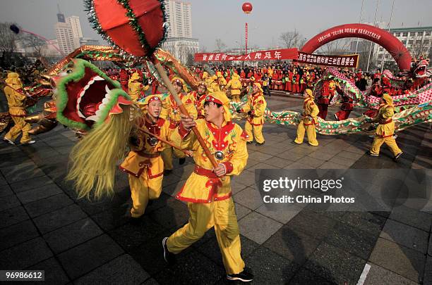 Folk artists perform Dragon Dance during a Folk Dragon Dance Contest which attracted about 40 teams, on February 23, 2010 in Taiyuan of Shanxi...