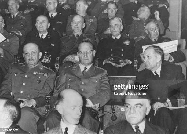 Nato Generals attend the opening of command exercise CPX7 at Supreme Headquarters Allied Powers Europe , Belgium, 15th April 1957. Middle row, left...