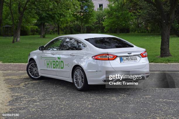 ford mondeo hybrid on the street - hybrid car stock pictures, royalty-free photos & images