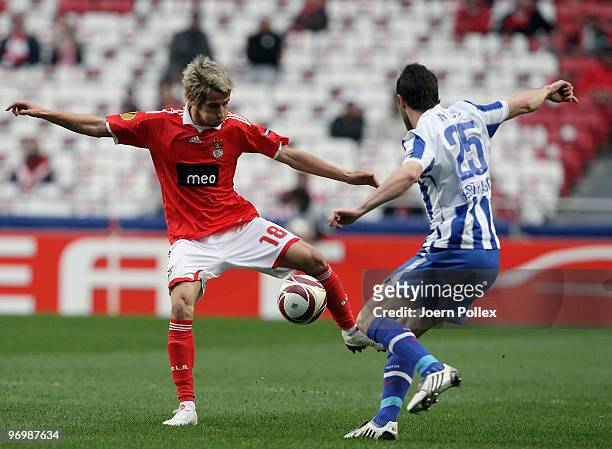 Maximilian Nicu of Berlin battles for the ball with Fabio Coentrao of Benfica during the UEFA Europa League knock-out round, second leg match between...