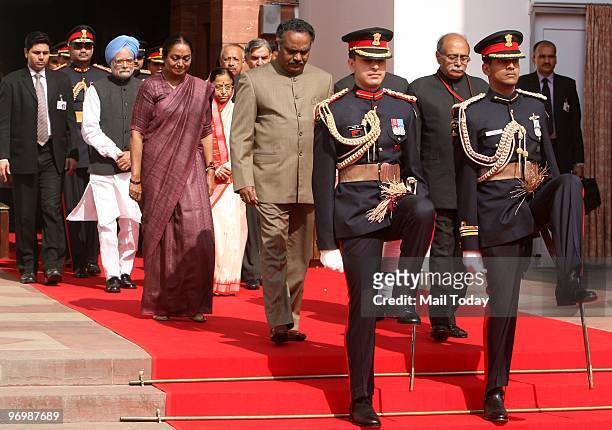 Presidential guards escort Prime Minister Manmohan Singh, President Pratibha Patil, Speaker Meira Kumar along with other ministers as they arrive at...