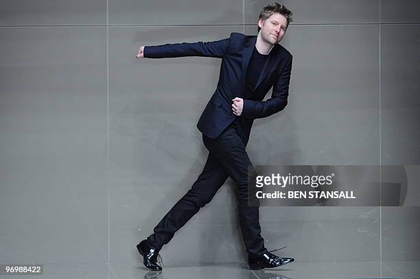 Fashion designer for Burberry Christopher Bailey acknowledges the audience following a fashion show for Burberry's Autumn/Winter 2010 collection on...