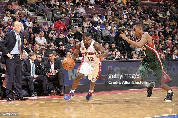 Will Bynum of the Detroit Pistons drives to the basket against Brandon Jennings of the Milwaukee Bucks during the game at the Palace of Auburn Hills...