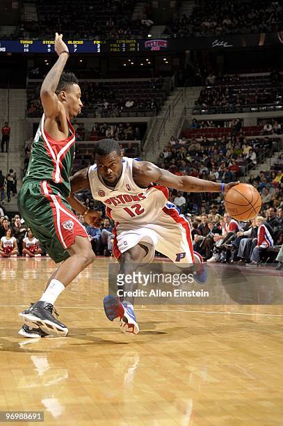Will Bynum of the Detroit Pistons drives to the basket against Brandon Jennings of the Milwaukee Bucks during the game at the Palace of Auburn Hills...