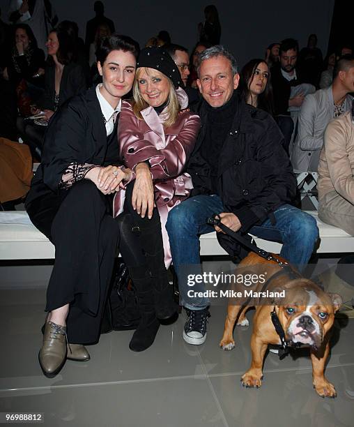Erin O'Conner, Twiggy and Patrick Cox pose on the front row at the Burberry Prorsum show for London Fashion Week Autumn/Winter 2010 at on February...
