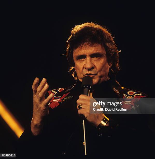 American singer Johnny Cash performs on stage at the Country Music Festival held at Wembley Arena, London on March 31, 1986.