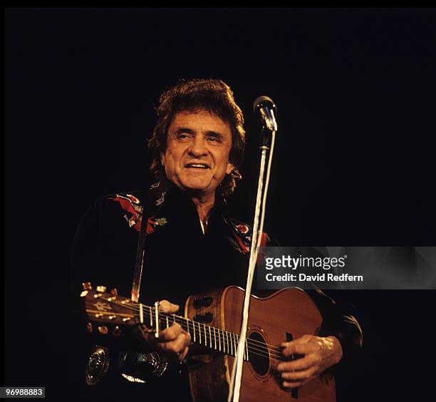 American singer Johnny Cash performs on stage at the Country Music Festival held at Wembley Arena, London on March 31, 1986.