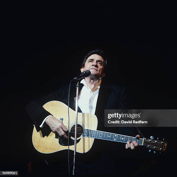 American singer Johnny Cash performs on stage at the Hammersmith Odeon in London, England on November 15, 1983.